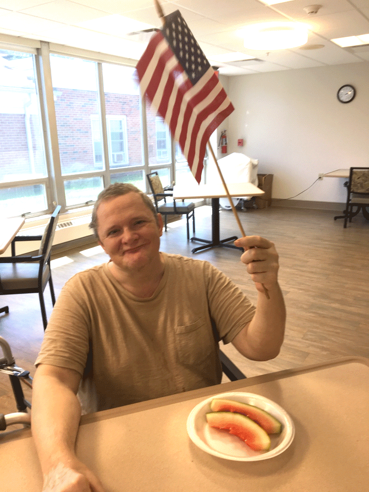 Resident holding a Flag