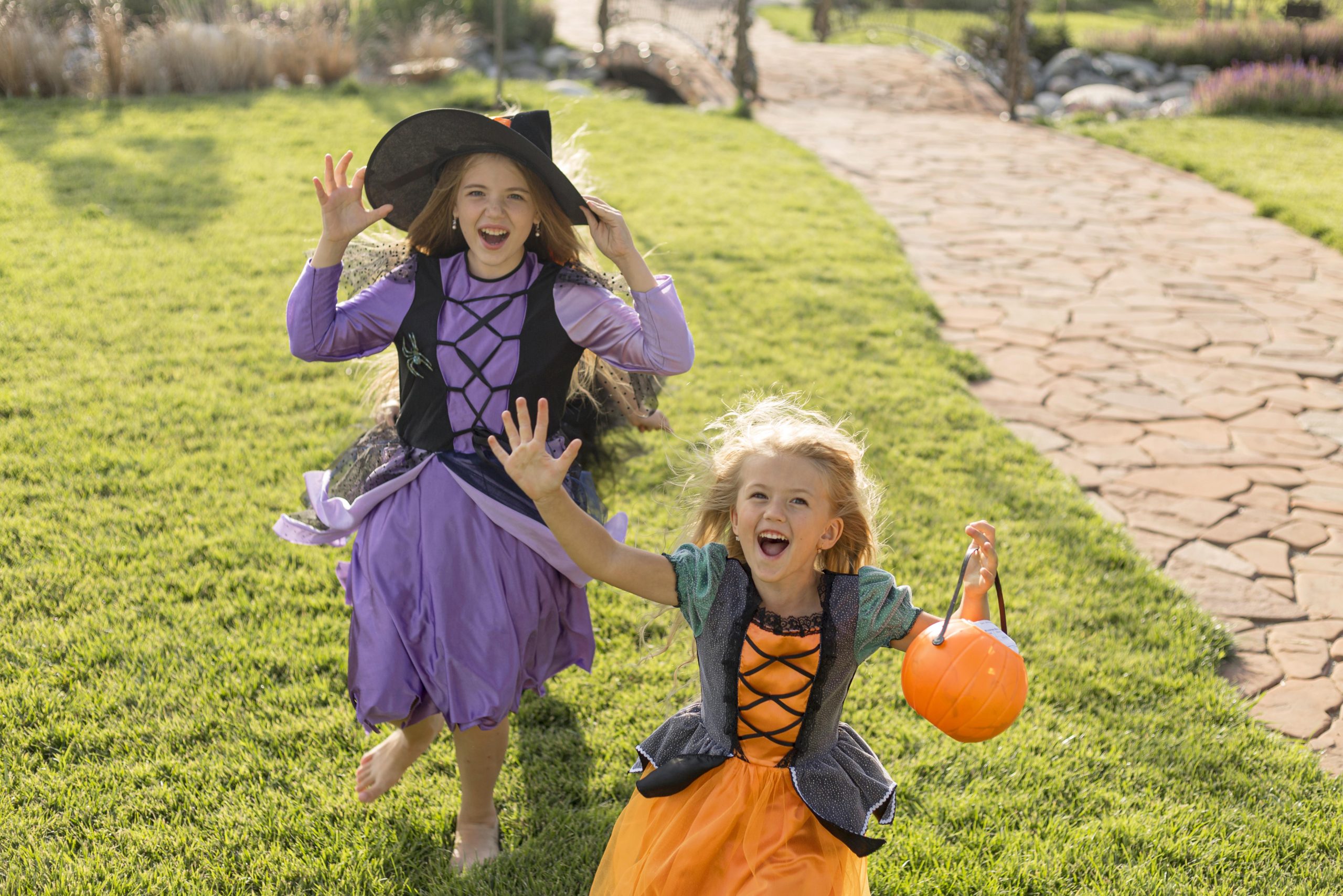 High-angle-cute-little-girls-with-halloween-costumes